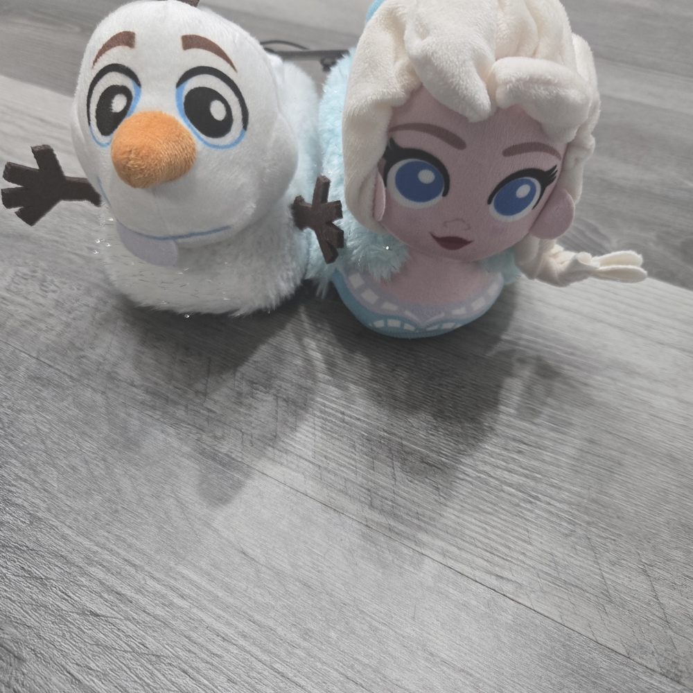 Disney Frozen toddler girls' sock top slippers feature mismatched Elsa and Olaf